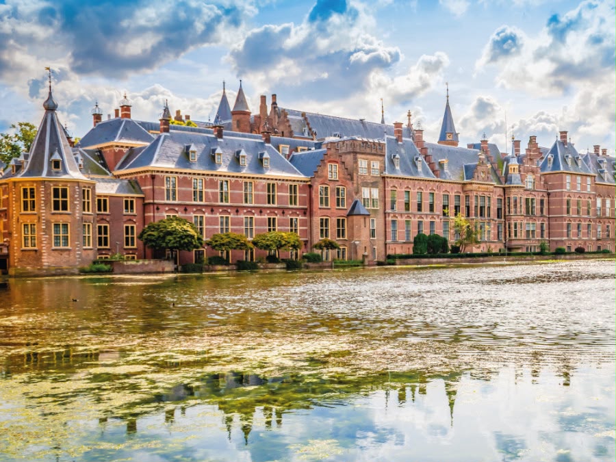 The historic Binnenhof parliament buildings reflected in the Hofvijver in The Hague