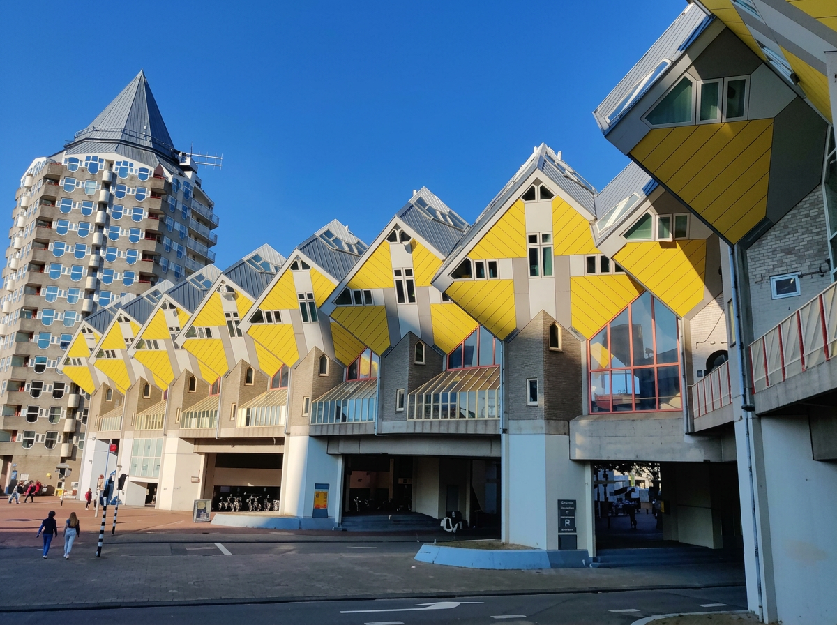 Street-level view of Rotterdam's Cube Houses and surrounding modern architecture
